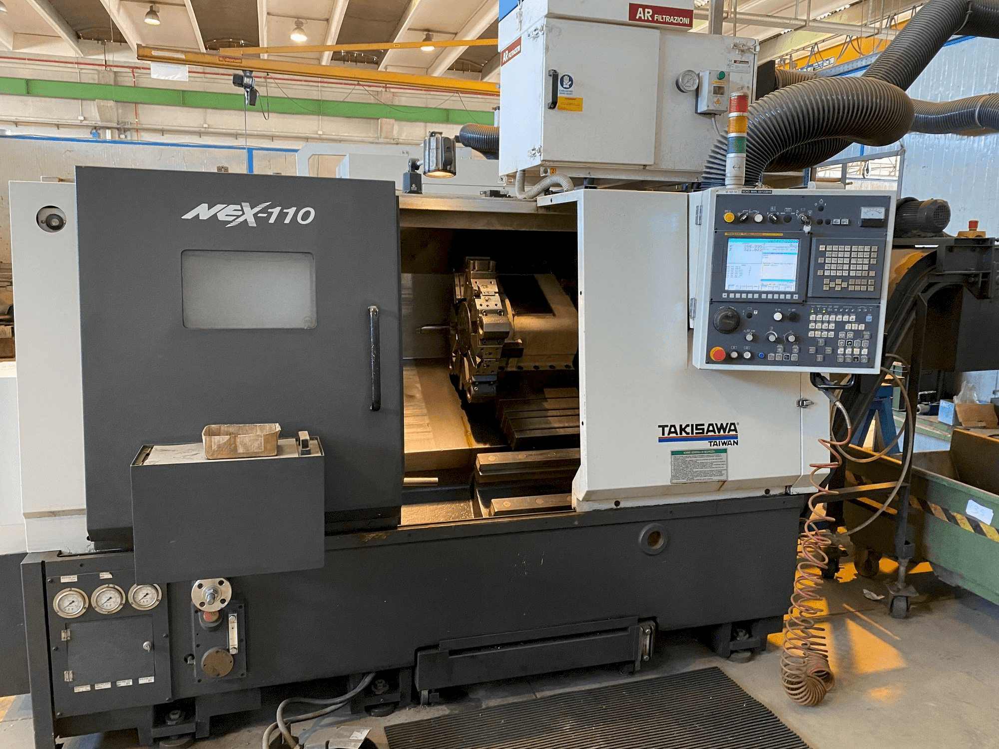 Takisawa NEX-110-maskinen framifrån