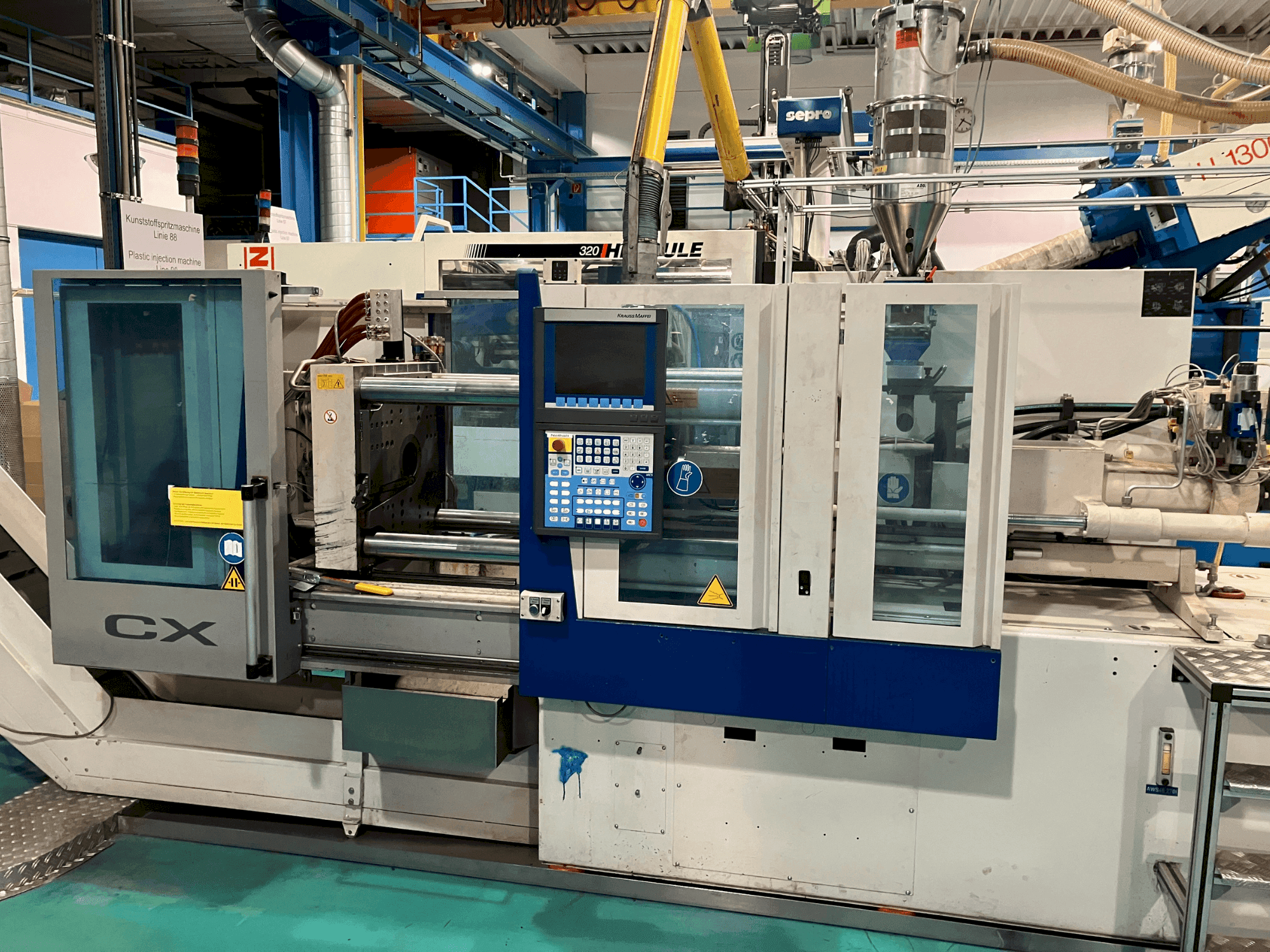 Krauss Maffei 65-180 CX-maskinen framifrån