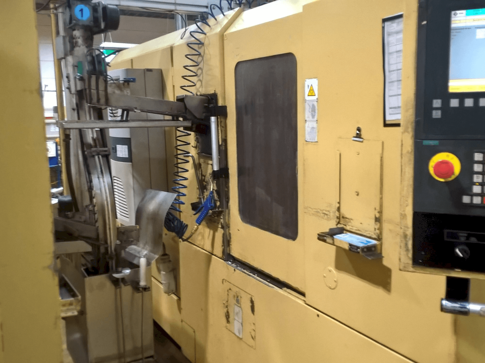 TAJMAC-ZPS SAL 100/4-maskinen sedd från höger sida