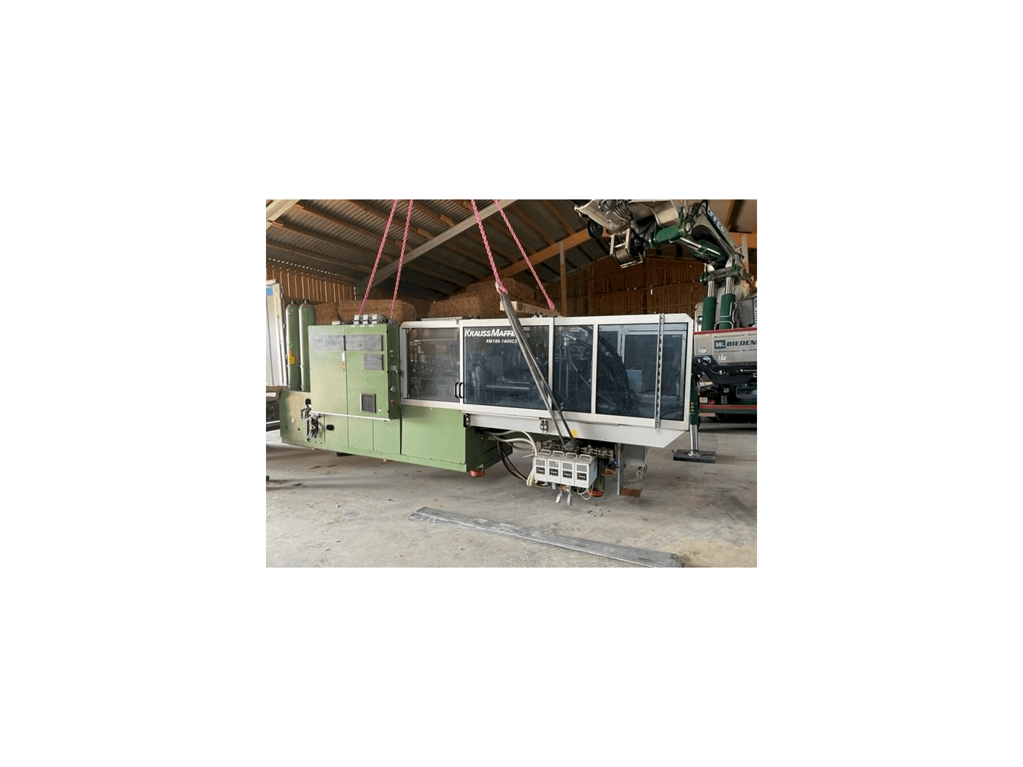 Krauss Maffei KW180 C3 hybrid-maskinen framifrån