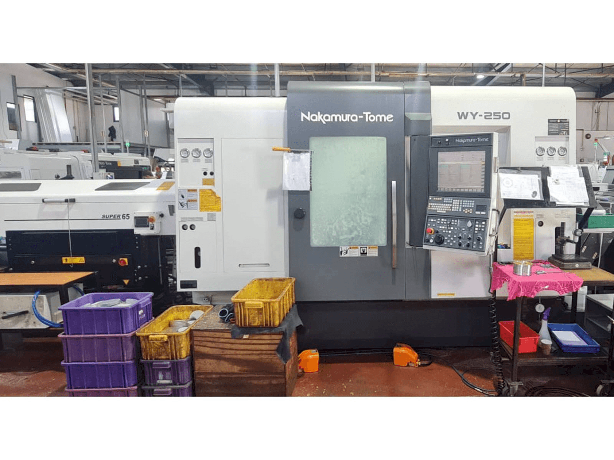 NAKAMURA-TOME WY 250-maskinen framifrån