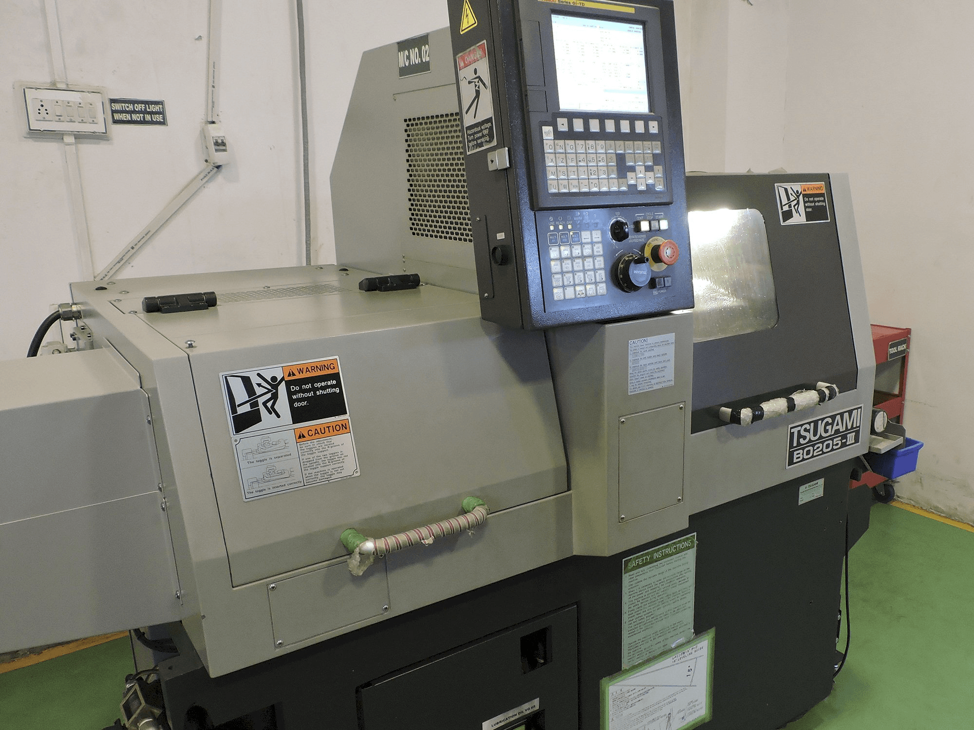 TSUGAMI-maskinen sedd från vänsterB0205-III