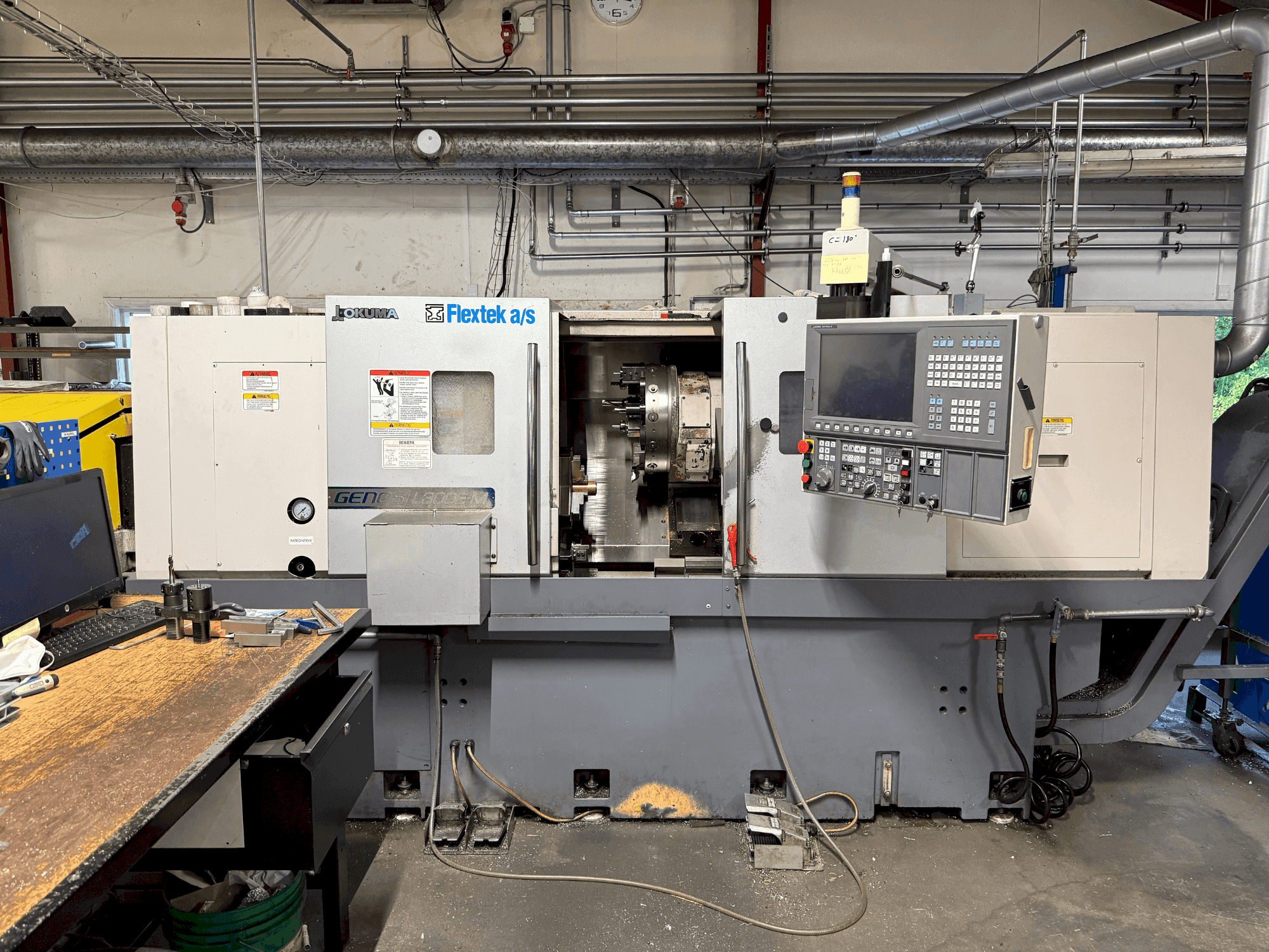 Okuma Genos L300E-M with FMB Turbo 8-80-maskinen framifrån