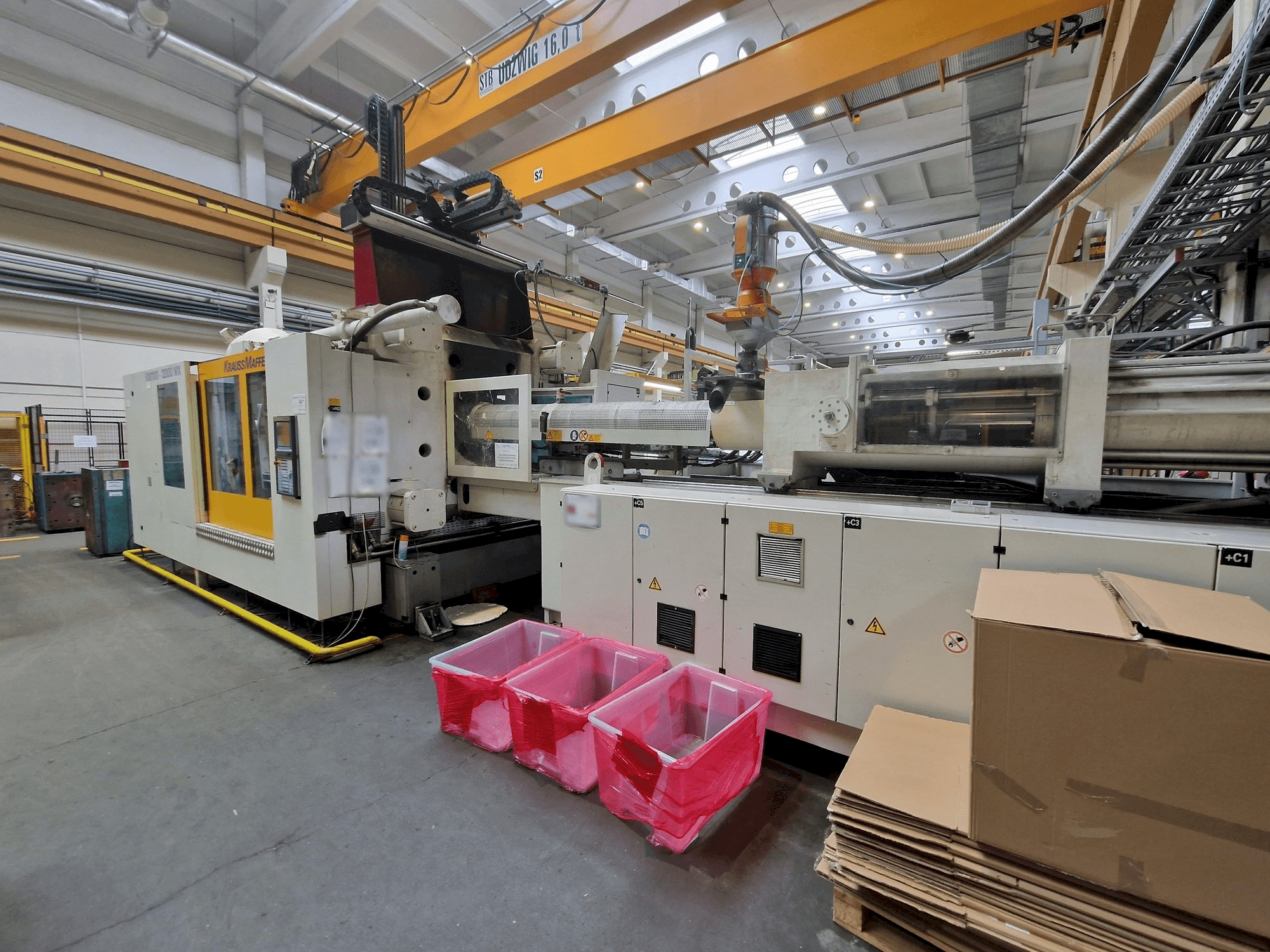 Krauss Maffei 1100-12000 MX-maskinen framifrån