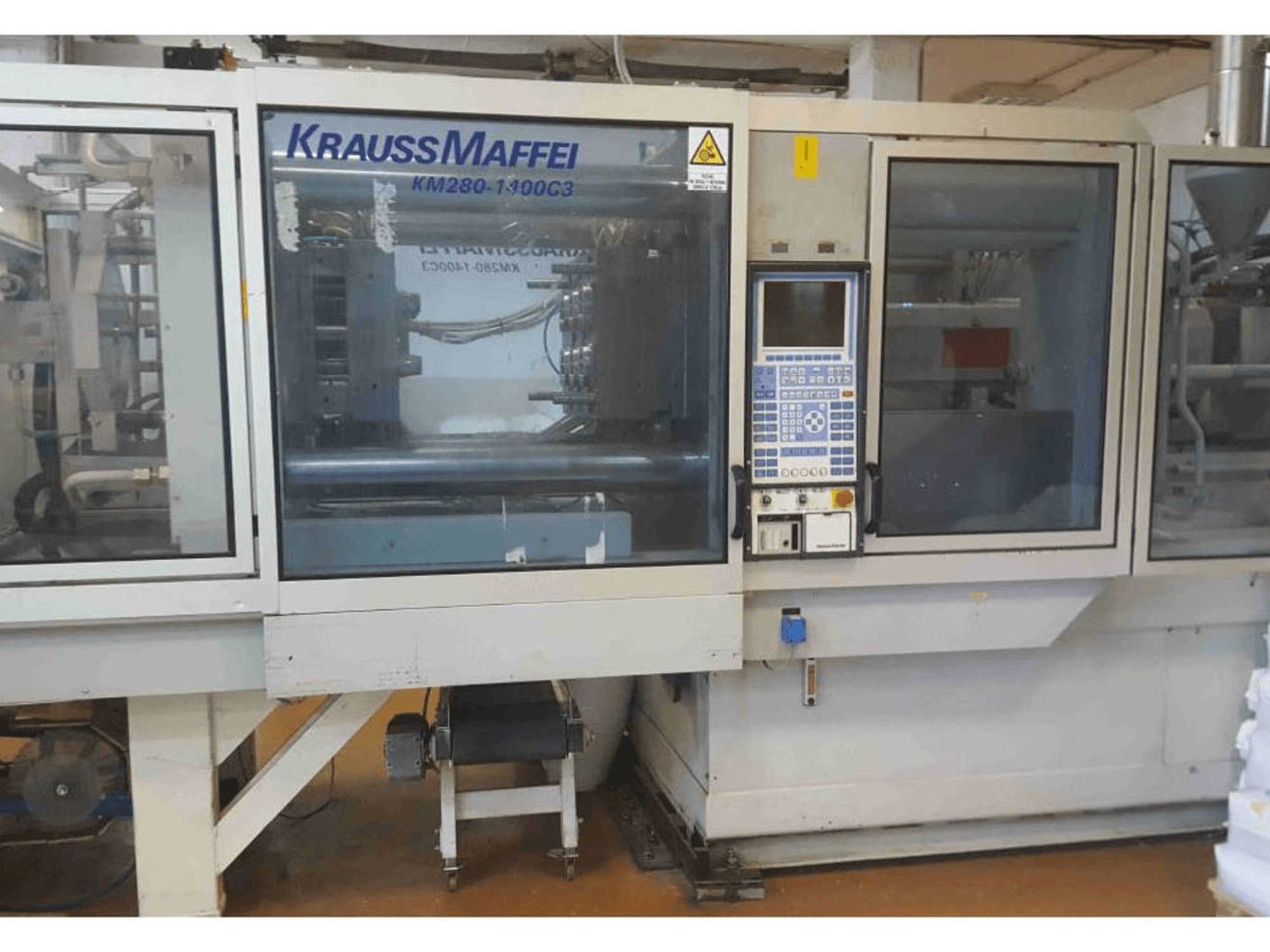 Krauss Maffei KM 280-1400 C3-maskinen framifrån