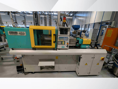 Arburg 270 S 400-60 hydraulisk formsprutningsmaskin sedd framifrån, med kontrollpanel och säkerhetskomponenter.