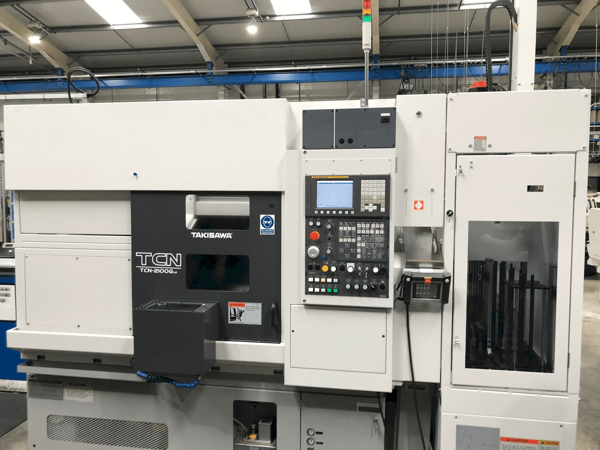 Takisawa TCN-2100G L6-maskinen framifrån