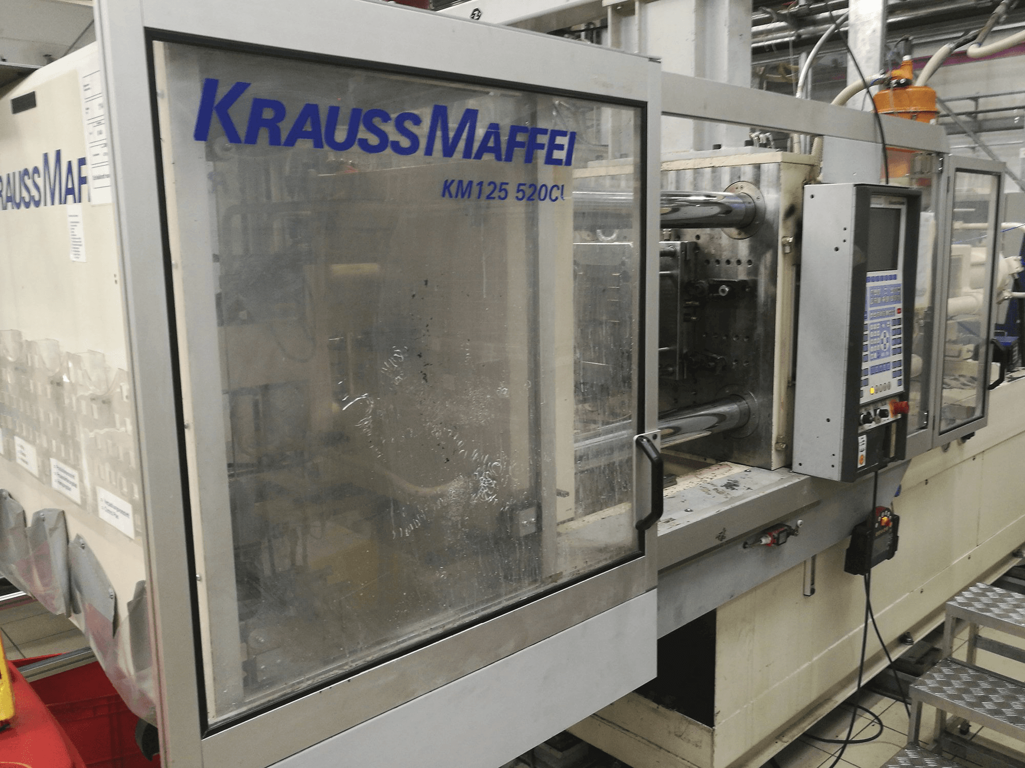 Krauss Maffei-maskinen framifrånKM 125-520 C1