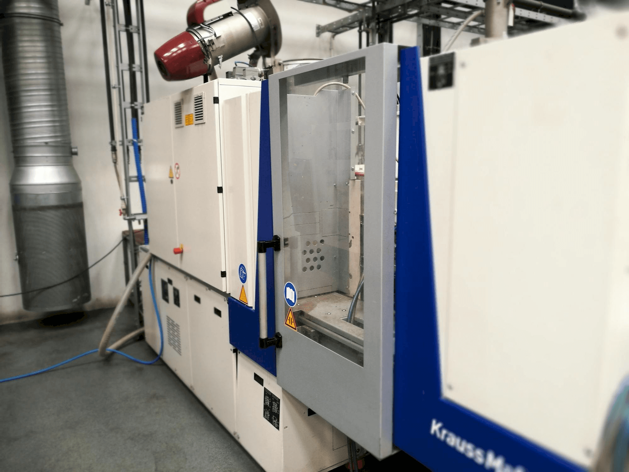 Krauss Maffei KM 35-55 CX-maskinen framifrån