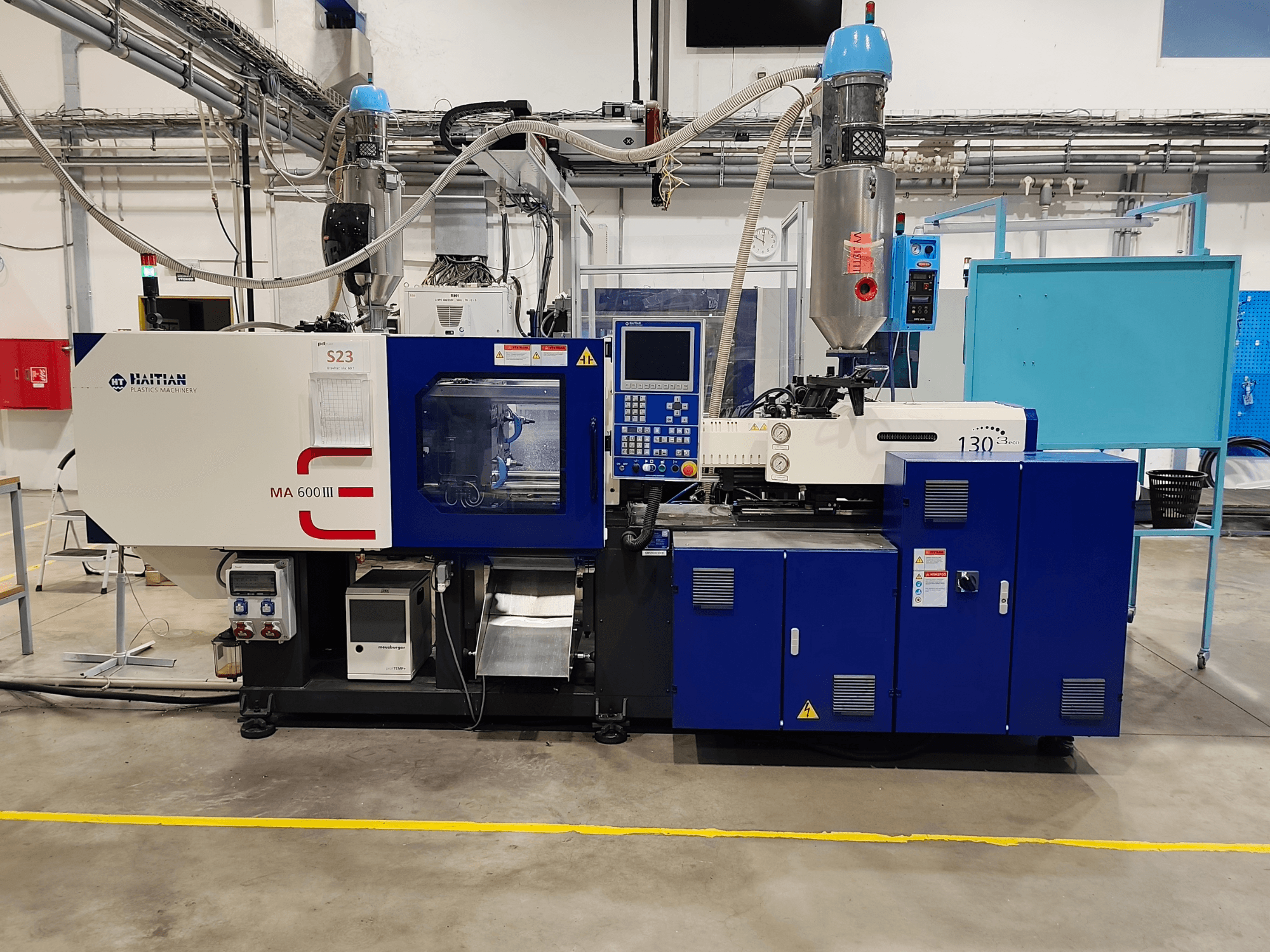 HAITIAN Mars III MA 600/130B eco – elektrisk formsprutningsmaskin, framifrån med kontrollpanelen och insprutningsenheten synliga.